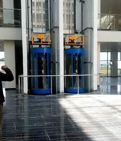 Pair of Five Star passenger elevators in a commercial lobby