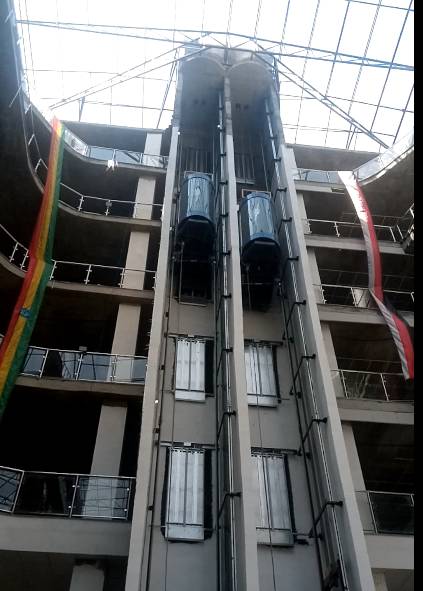 Five Star elevators running through multi-floor atrium